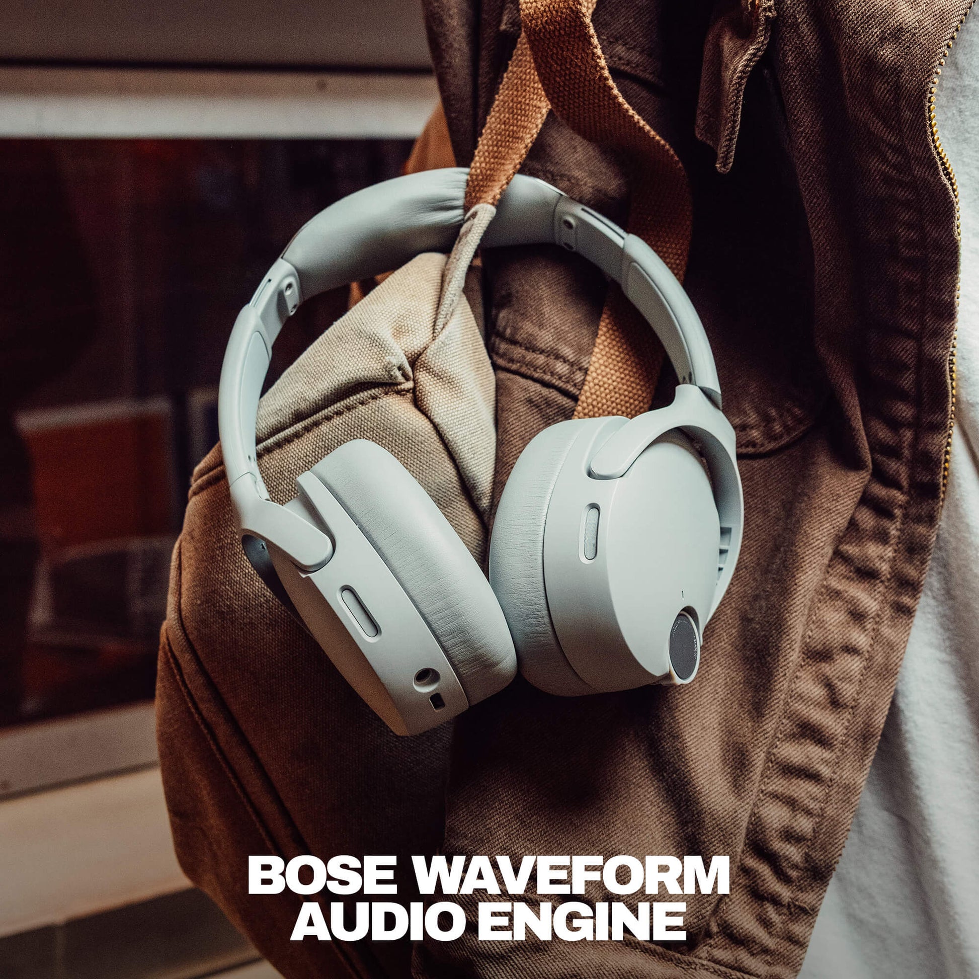 Skullcandy crusher 1080 ANC with sound by Bose headphones on a brown jacket with 'Bose Waveform Audio Engine' text. | Cement