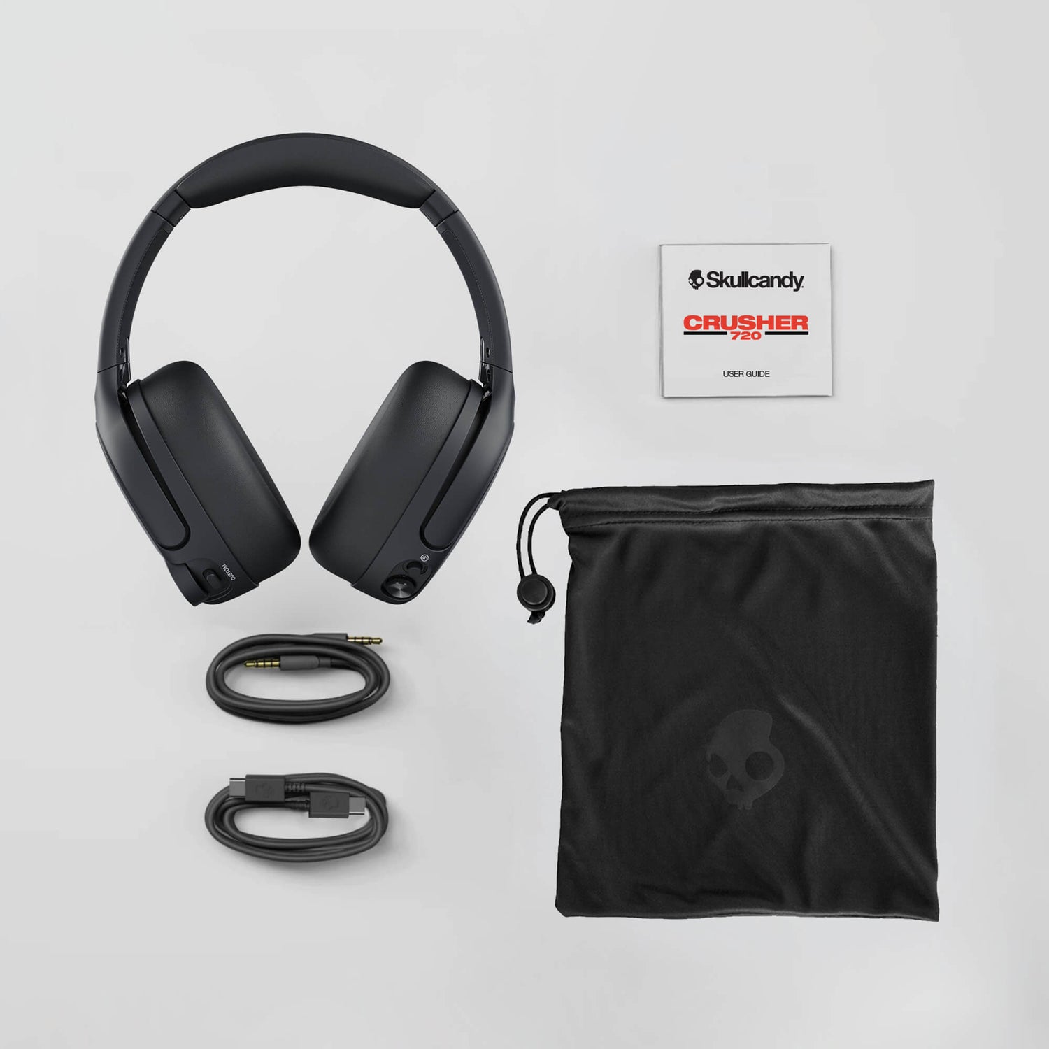 Skullcandy Crusher 720 headphones with accessories on a light gray background | Primer