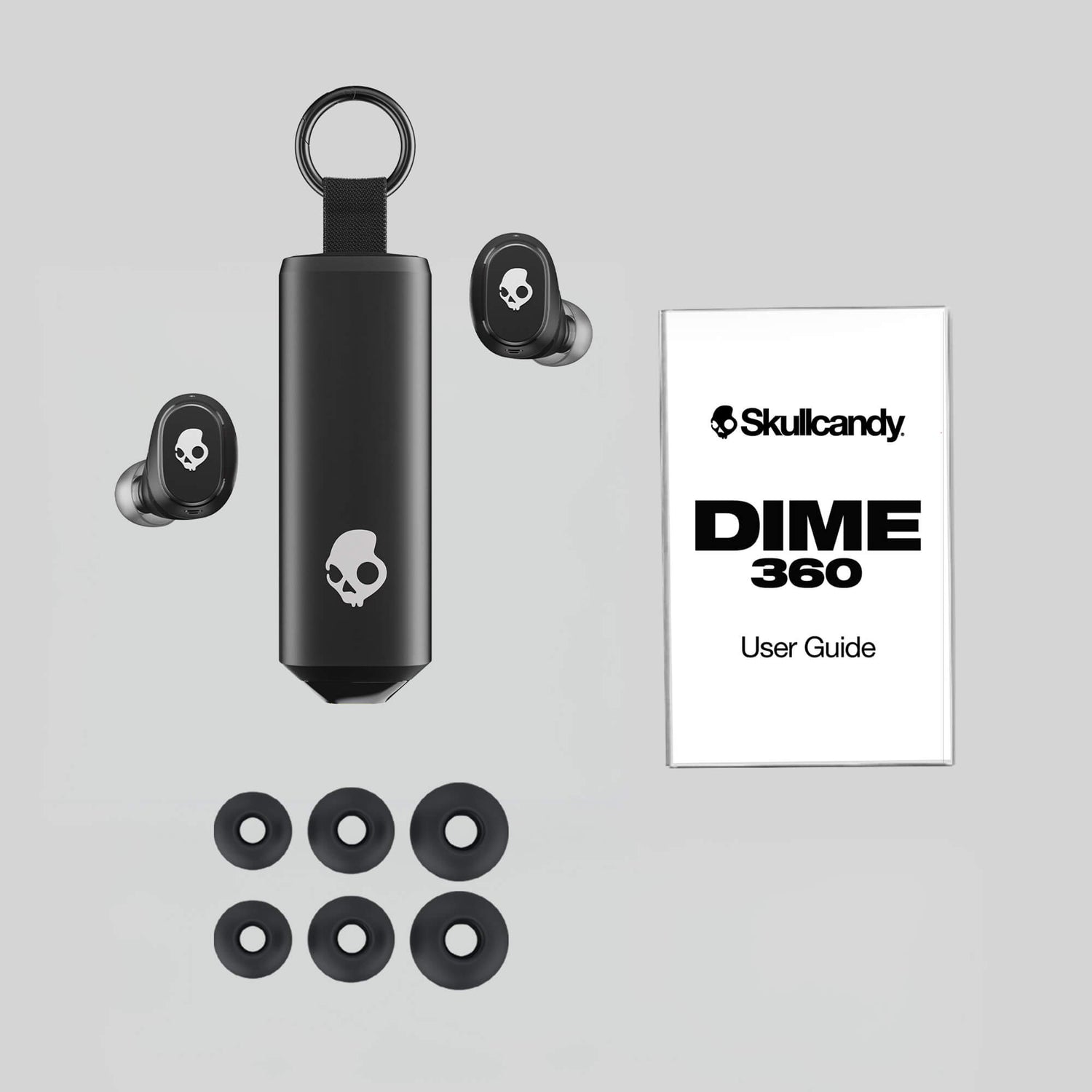 Skullcandy Dime 360 earbuds with case and user guide on a gray background | Skullcandy X Peanuts Lucy