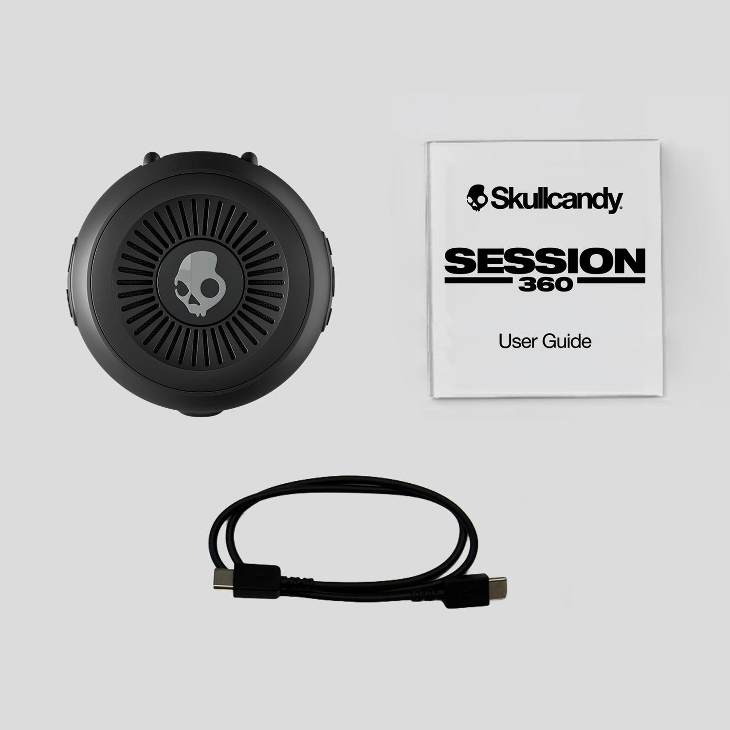 Skullcandy Session 360 headset with user guide on a light gray background | Primer