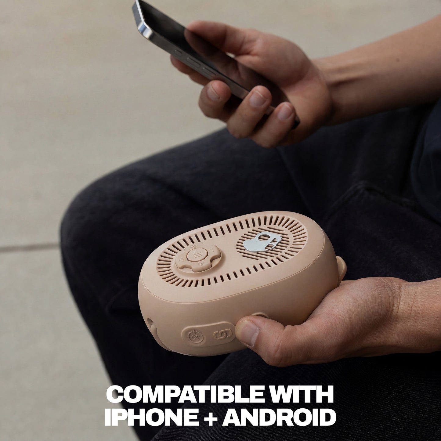 Person holding a beige portable device and a smartphone, with text indicating compatibility with iPhone and Android. | Primer